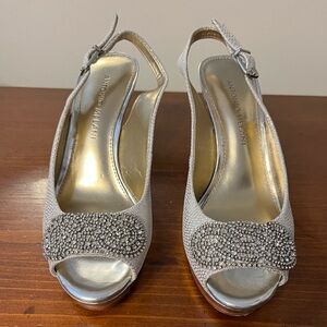 Size 6 Antonio Melani 4” heel, in silver with a snake skin pattern.